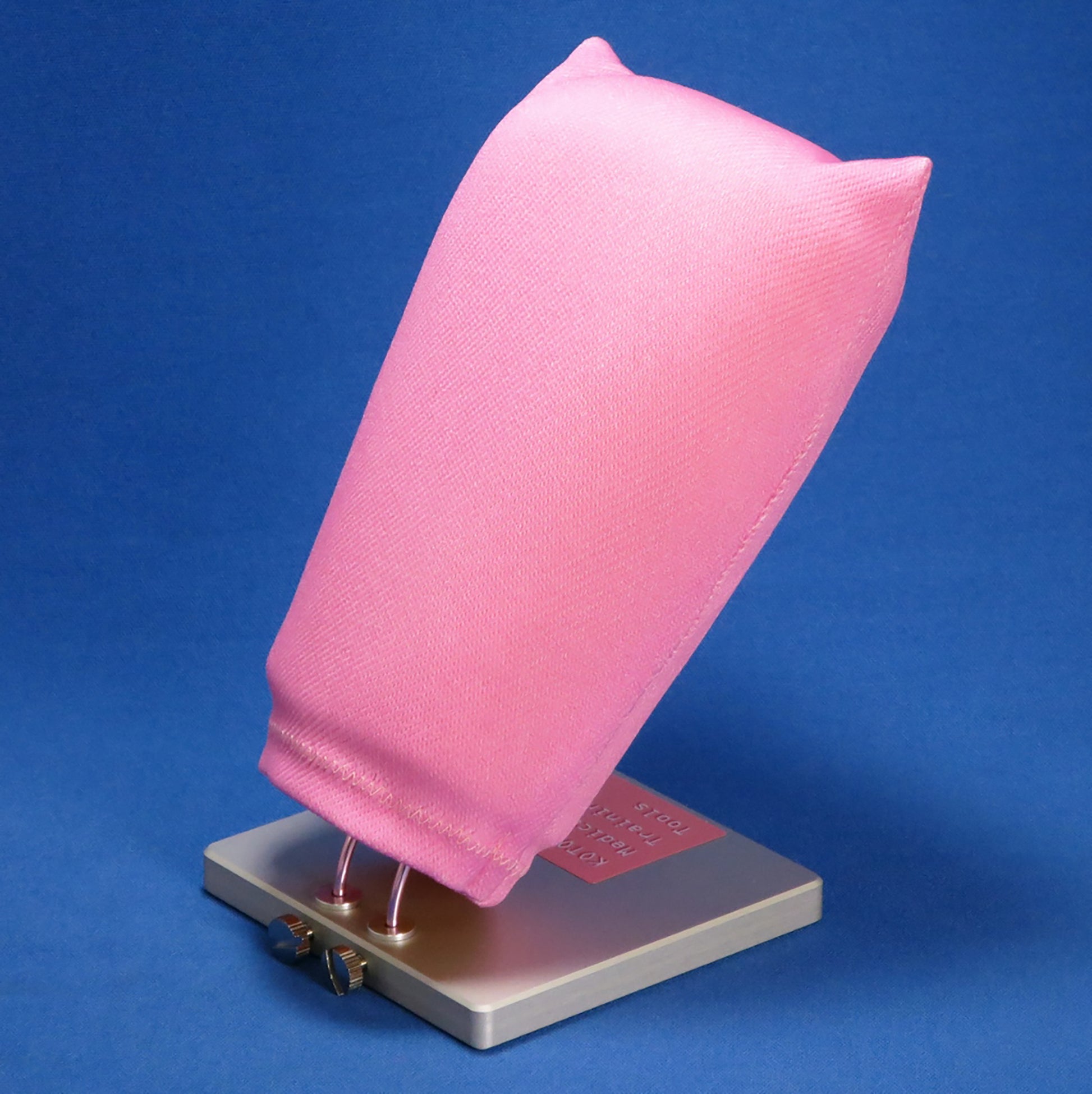 The LM Suture Training model is propped up on bendable wires for easy adjustment during training.