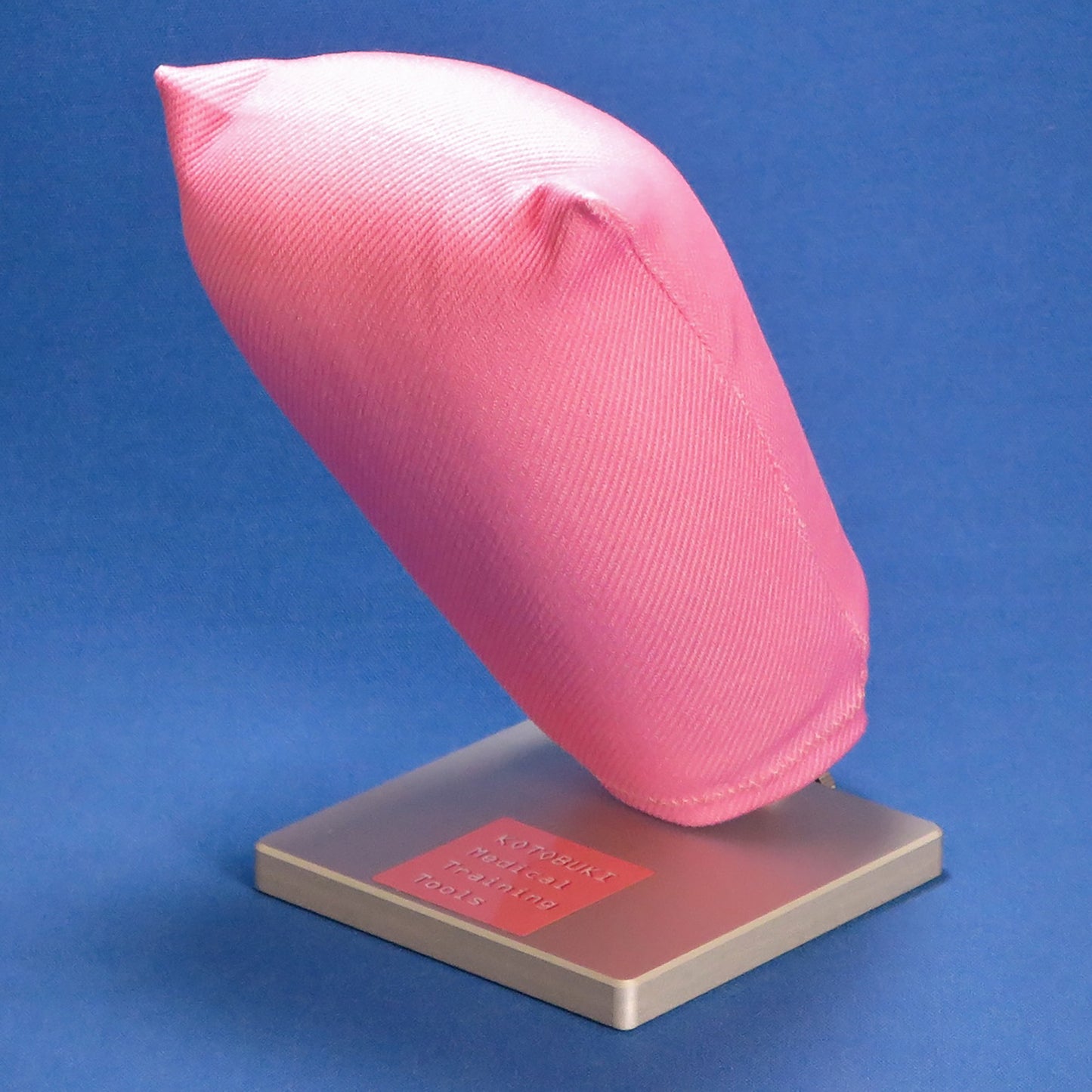 A pink, synthetic vaginal stump used for hysterectomy ligature training.