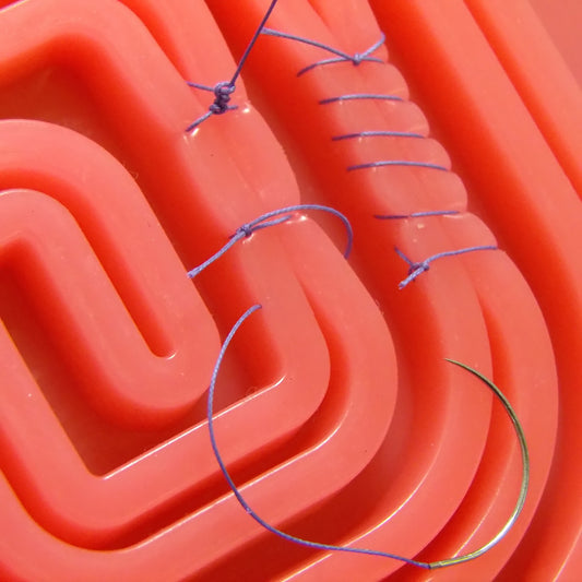 Multiple types of ligature knots performed on the Training Pad Swirl. 